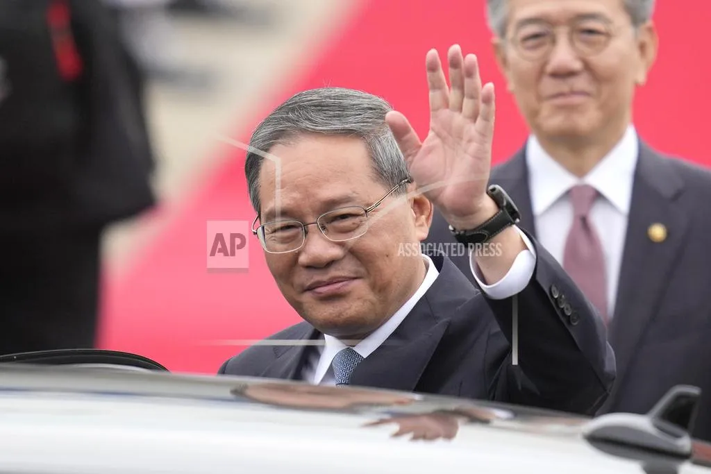 Chinese Premier Li Qiang Waves To Media Members Before Getting Into A Car As Kim Hong Kyun